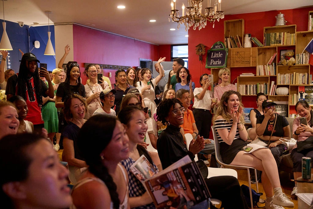 Coucou students and staff cheering the Paris Olympics, having fun, a candid moment.