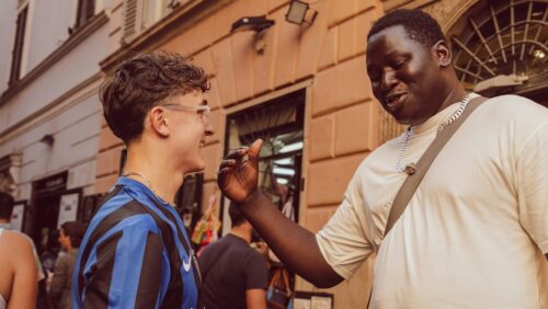 Two young people talking on the street